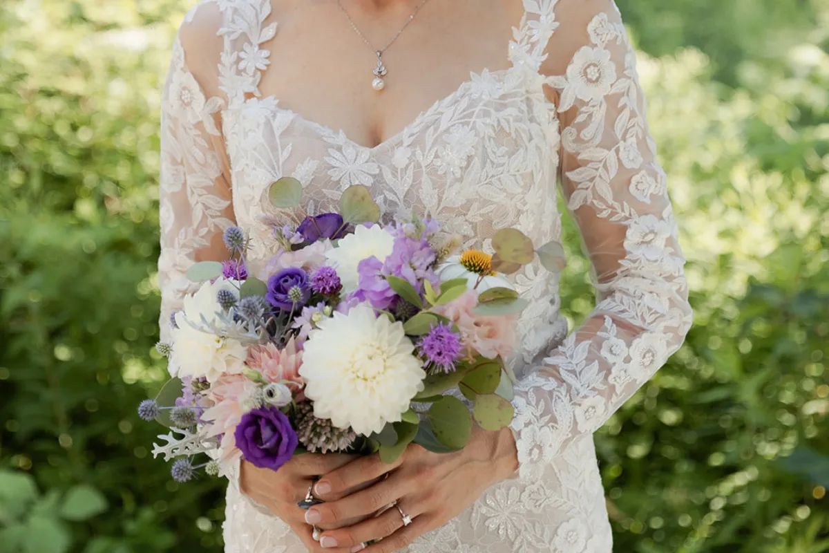 Bridal bouquet with native wildflowers in purples and whites